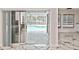 Pool view through sliding glass doors, showcasing a refreshing pool area with stone pavers at 27416 Natal Dr, Punta Gorda, FL 33983