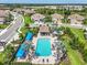Aerial view of the pool area with cabana and beautiful landscaping in a great neighborhood at 27467 Janzen Ct, Englewood, FL 34223
