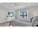 Relaxing bedroom with a calming view of the lake, light neutral decor, and a TV at 27467 Janzen Ct, Englewood, FL 34223