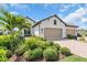 A lovely home with a two-car garage, brick paved driveway, and well maintained landscaping at 27467 Janzen Ct, Englewood, FL 34223