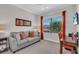 This room features a comfy couch, a desk, and a large sunny window at 27467 Janzen Ct, Englewood, FL 34223