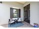 Inviting patio featuring comfortable chairs, a small table, and a stylish rug perfect for relaxing at 27467 Janzen Ct, Englewood, FL 34223