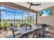Entertain on the covered and screened patio with a view of the lake at 27467 Janzen Ct, Englewood, FL 34223