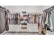 Ample storage in this walk-in closet with metal shelving and hanging rods at 27467 Janzen Ct, Englewood, FL 34223