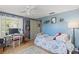 A cozy bedroom provides a relaxing retreat with a desk and plenty of room for personalization at 318 Venice East Blvd, Venice, FL 34293