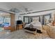 Bright and airy main bedroom with ensuite access and a large window with beautiful drapery at 318 Venice East Blvd, Venice, FL 34293