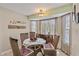 Cozy dining area featuring charming decor and views of the lush surroundings at 318 Venice East Blvd, Venice, FL 34293