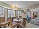 Cozy dining area featuring charming decor and views of the lush surroundings at 318 Venice East Blvd, Venice, FL 34293