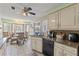 Bright eat-in kitchen featuring updated appliances and fixtures, and breakfast nook with backyard views at 318 Venice East Blvd, Venice, FL 34293