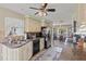 The home features a fully equipped kitchen with stainless steel appliances and eat-in dining area at 318 Venice East Blvd, Venice, FL 34293