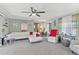 Bright living room featuring a large sectional sofa and comfortable seating at 318 Venice East Blvd, Venice, FL 34293