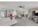 Spacious living room with modern furniture, a ceiling fan, and an open layout at 318 Venice East Blvd, Venice, FL 34293