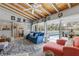 Bright living room with vaulted ceilings and access to the screened-in pool area at 318 Venice East Blvd, Venice, FL 34293
