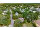 A beautiful aerial view of a neighborhood with mature trees, well-kept homes, and a distant skyline at 3181 Alta Vista St, Sarasota, FL 34237
