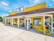 Charming yellow market building with ample windows and inviting storefront appeal at 3181 Alta Vista St, Sarasota, FL 34237