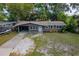 This single-story home features a well-maintained lawn and inviting front door, creating a warm and welcoming entrance at 3181 Alta Vista St, Sarasota, FL 34237