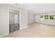 Bright and spacious living area with tile flooring, connecting to other living spaces at 3181 Alta Vista St, Sarasota, FL 34237