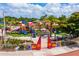 Aerial view of a colorful playground with various play structures and vibrant colors, inviting outdoor fun at 3181 Alta Vista St, Sarasota, FL 34237