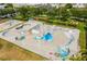Aerial view of a skatepark with ramps, bowls, and artistic graffiti, providing a vibrant space for skateboarders at 3181 Alta Vista St, Sarasota, FL 34237