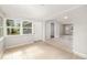 Sunroom with tile flooring, lots of windows providing natural light, and access to the outdoors at 3181 Alta Vista St, Sarasota, FL 34237
