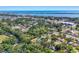 Aerial view of community showcases the home's location in a lush, treelined neighborhood near the bay at 352 Glenwood Ave, Osprey, FL 34229