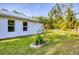 Well-maintained backyard with lush lawn and manicured landscaping at 352 Glenwood Ave, Osprey, FL 34229