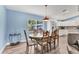Bright dining room with hardwood floors and a view of the kitchen; perfect for entertaining at 352 Glenwood Ave, Osprey, FL 34229