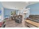 Open concept living and dining area with hardwood floors, comfortable seating, and lots of space at 352 Glenwood Ave, Osprey, FL 34229