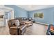 Spacious living room with hardwood floors, comfortable seating, and ample natural light at 352 Glenwood Ave, Osprey, FL 34229