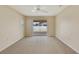 Spacious room with sliding glass doors leading to an outdoor patio at 3851 Sterling Rd, Venice, FL 34293