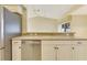 Kitchen with stainless steel appliances and modern countertops overlooking a bright and open living space at 3851 Sterling Rd, Venice, FL 34293