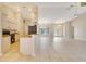 Open floorplan featuring a kitchen with a breakfast bar and an expansive living space with access to the outdoors at 3851 Sterling Rd, Venice, FL 34293