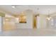 Large living room features tile floors and neutral colors, a breakfast bar, and ample space for entertaining at 3851 Sterling Rd, Venice, FL 34293