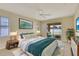 Comfortable bedroom with large window, ceiling fan, carpet, and sliding doors leading to patio at 3851 Sterling Rd, Venice, FL 34293