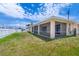 Backyard featuring a screened-in lanai, perfect for enjoying the outdoors at 3851 Sterling Rd, Venice, FL 34293