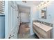 Bathroom with a stylish vanity and modern fixtures leads to a bright living space at 409 Armada S Rd, Venice, FL 34285