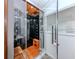 Luxurious bathroom featuring a steam shower, wooden accents, and modern fixtures at 409 Armada S Rd, Venice, FL 34285