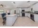Updated kitchen featuring white cabinets, a decorative backsplash, and modern appliances at 409 Armada S Rd, Venice, FL 34285