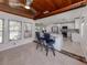 Open-concept kitchen with granite countertops and stainless steel appliances, adjacent to the dining area at 409 Armada S Rd, Venice, FL 34285