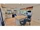 Open concept kitchen boasts white cabinetry, two islands with seating, and stainless steel appliances at 409 Armada S Rd, Venice, FL 34285