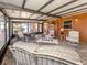 Inviting sunroom with comfortable seating, tile flooring, and a tranquil atmosphere at 409 Armada S Rd, Venice, FL 34285