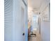 Hallway bathroom featuring a built-in closet and vanity at 410 Mission E Trl # B, Venice, FL 34285