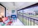 Relaxing screened lanai with comfortable seating offers serene water views for outdoor enjoyment at 410 Mission E Trl # B, Venice, FL 34285