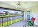 Charming screened lanai offers tranquil views and comfortable seating, perfect for enjoying the outdoors at 410 Mission E Trl # B, Venice, FL 34285