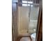 Bathroom showing a shower with glass door and a toilet at 417 Via Veneto, Venice, FL 34285
