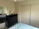 View of a bedroom with a dresser and closet with sliding doors at 417 Via Veneto, Venice, FL 34285