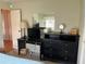 Bedroom featuring a desk, mirror, dresser and doorway to the hall at 417 Via Veneto, Venice, FL 34285