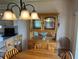 Classic dining room with a wooden hutch, adjacent to the well-equipped kitchen at 417 Via Veneto, Venice, FL 34285