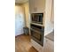 Kitchen area with stainless steel oven, microwave and cabinets at 417 Via Veneto, Venice, FL 34285