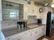 Light and airy kitchen with neutral countertops and ample storage at 417 Via Veneto, Venice, FL 34285